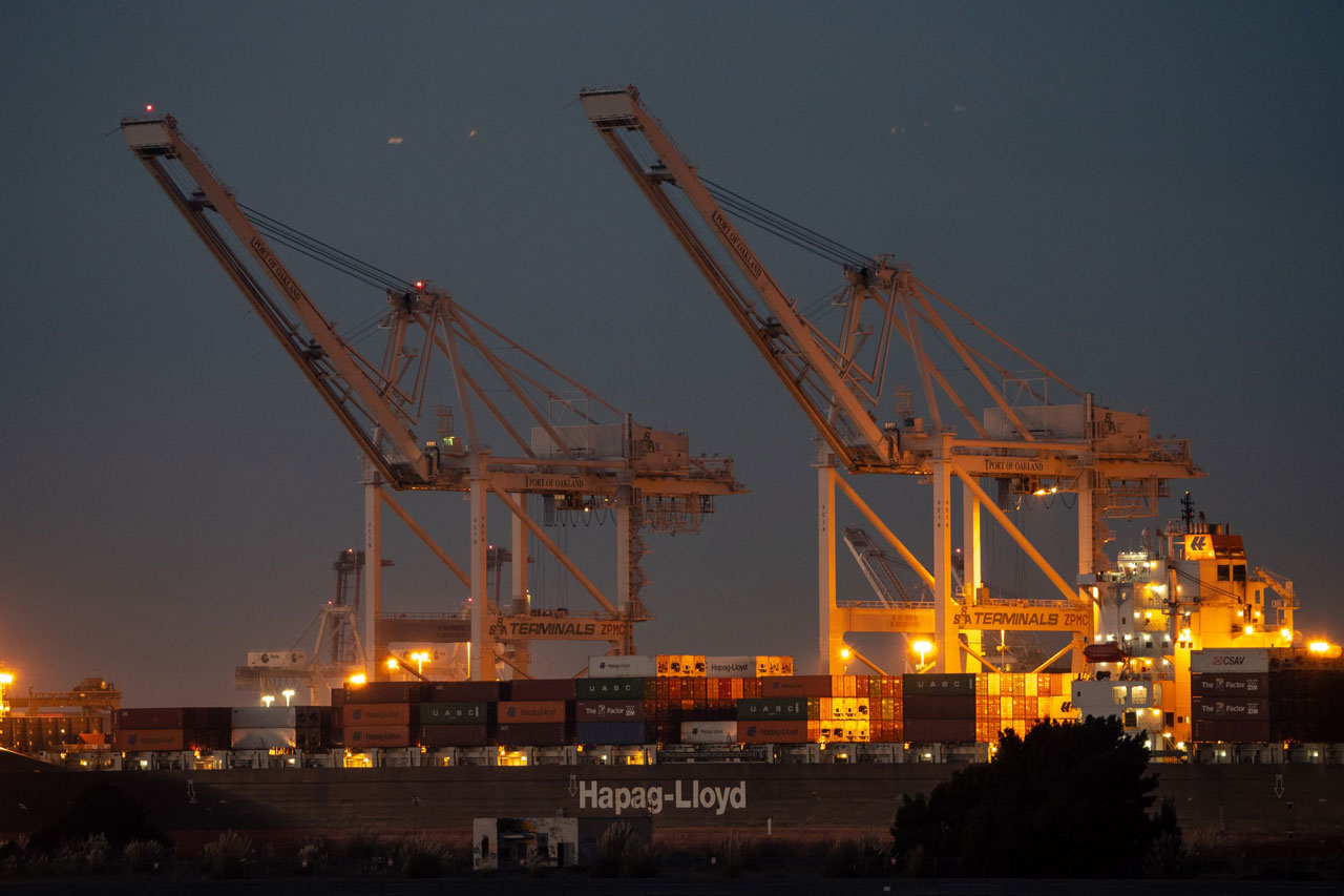 port-of-oakland-protests Hapag-Lloyd vessel and two cranes at the Port of Oakland