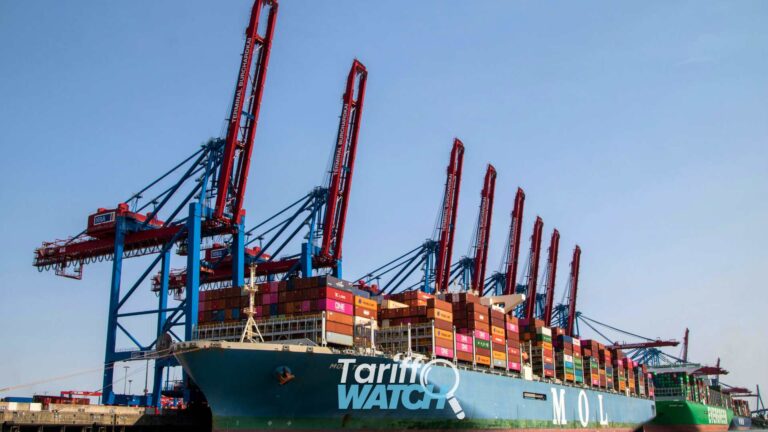 Container ship at a commercial cargo port representing the Section 232 aircraft proclamation, HTS reporting updates, de minimis deadlines, customs compliance, international trade, and global supply chain developments featured in Tariff Watch.